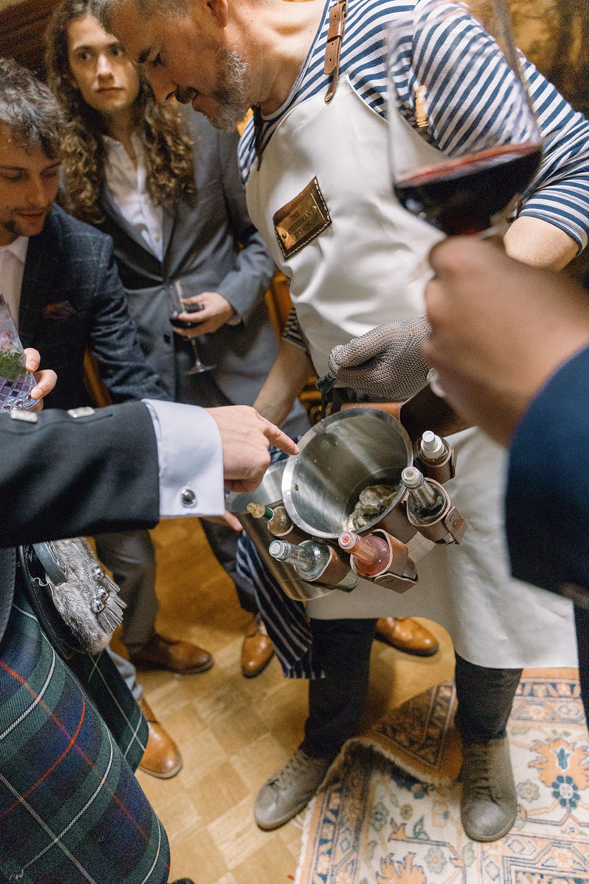 The Oysterman Events serving freshly shucked oysters to guests during Dundas Castle wedding reception.