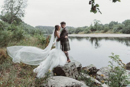 Couple portraits in front of loch