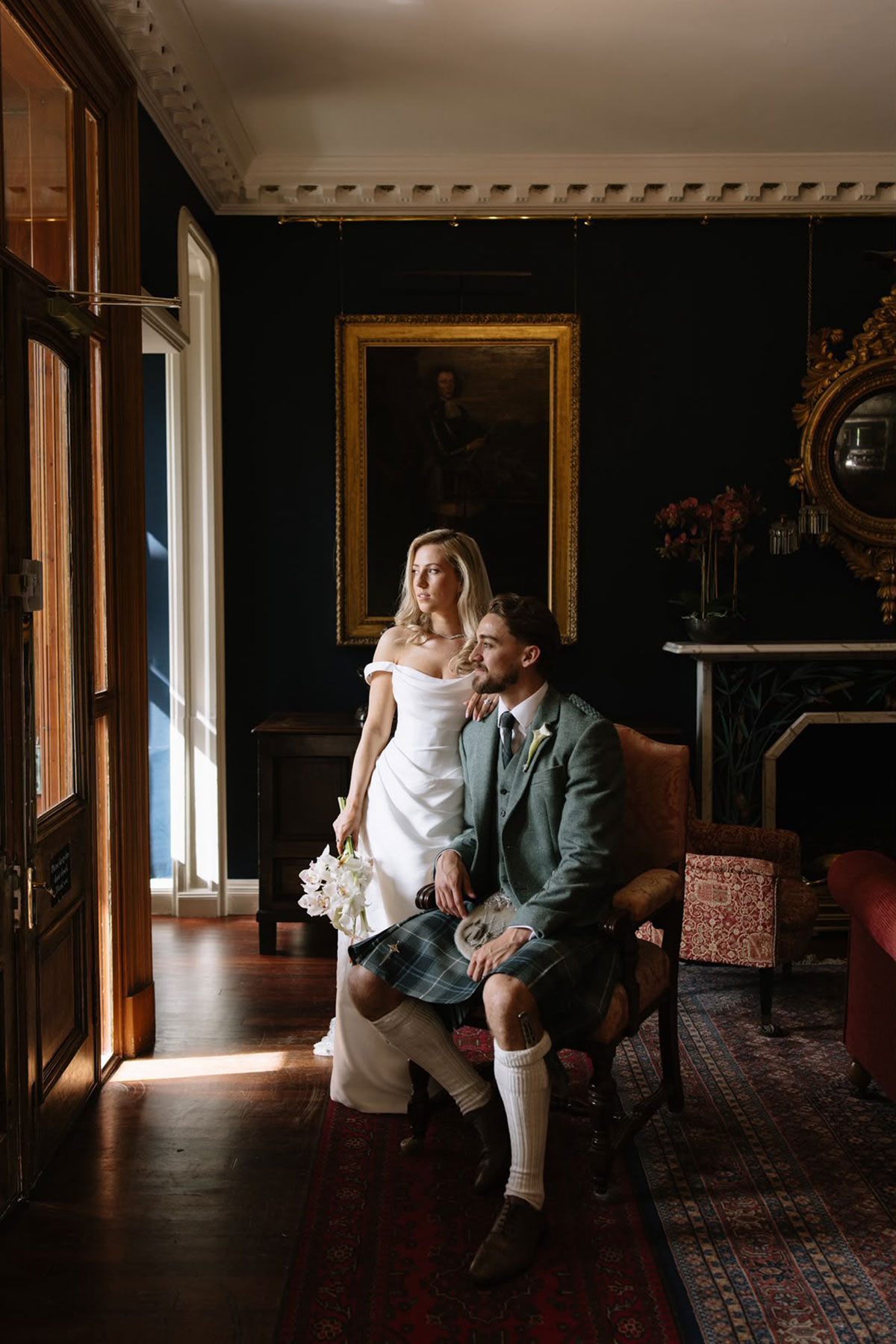 Bride and groom posing inside Cambo House wedding venue in Fife