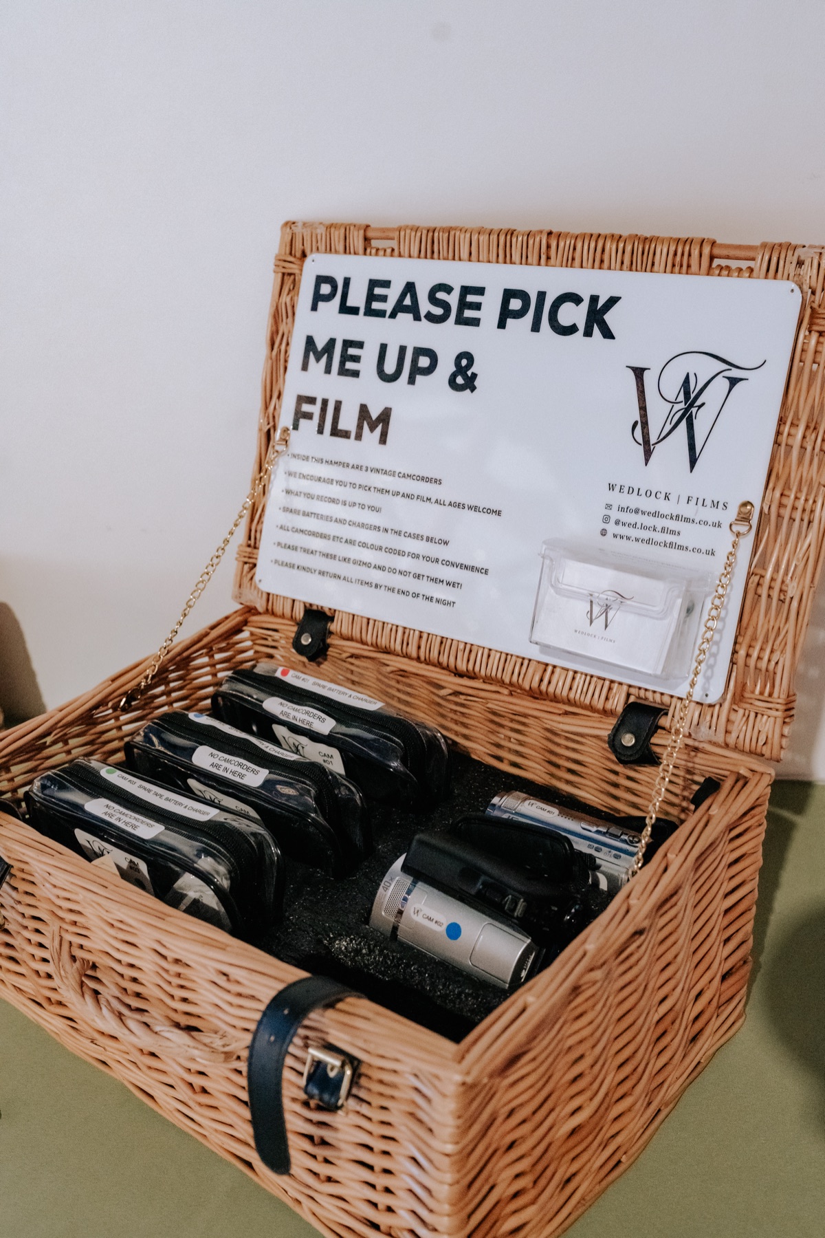 Vintage camcorders from Wedlock Films set out for guests to record messages at a Harvest Moon wedding.
