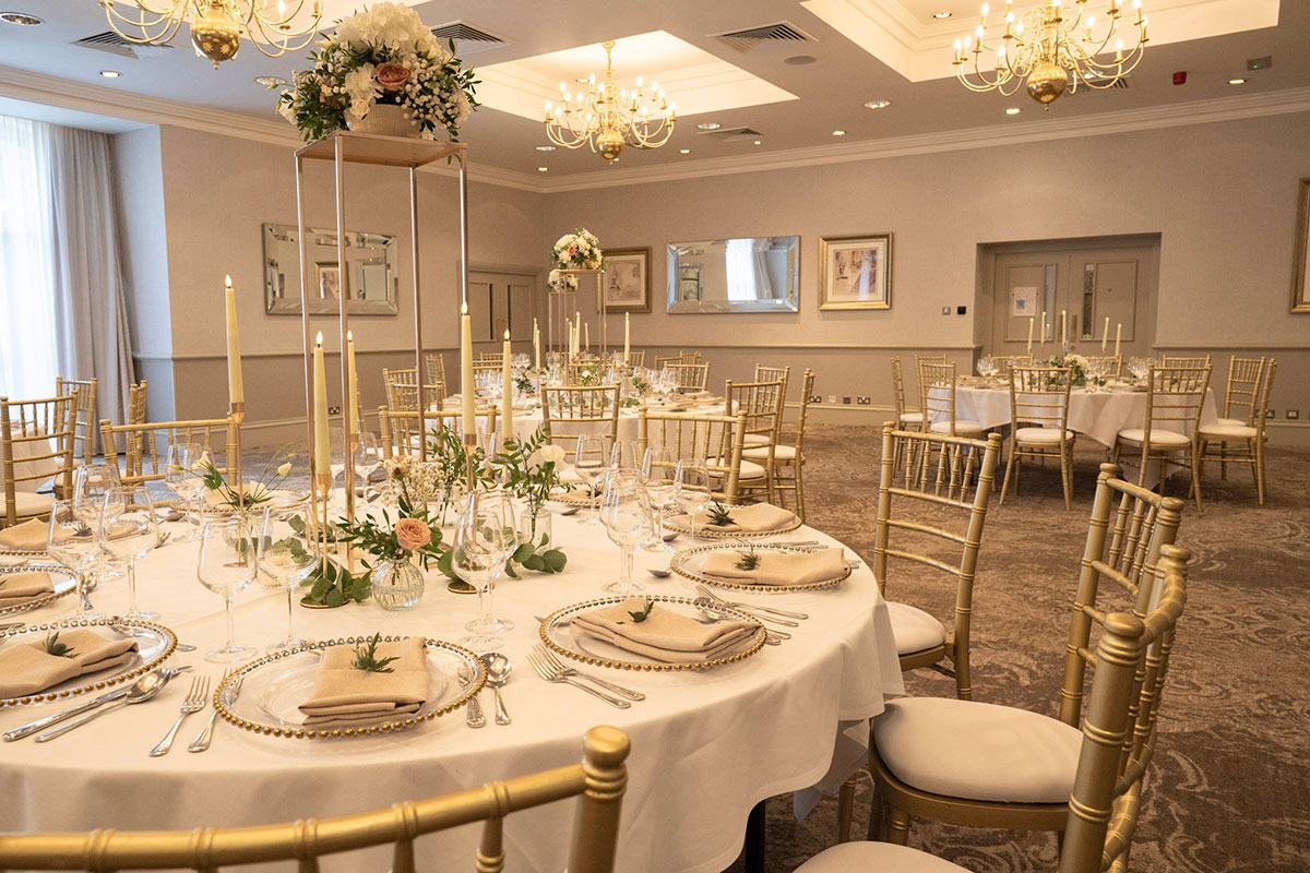 Close-up of the Usher Suite wedding reception styling with floral centrepieces, candlelight and beautifully dressed tables for a Scottish wedding