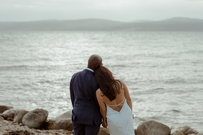 A Bride And Groom Looking Out To Sea On Arran
