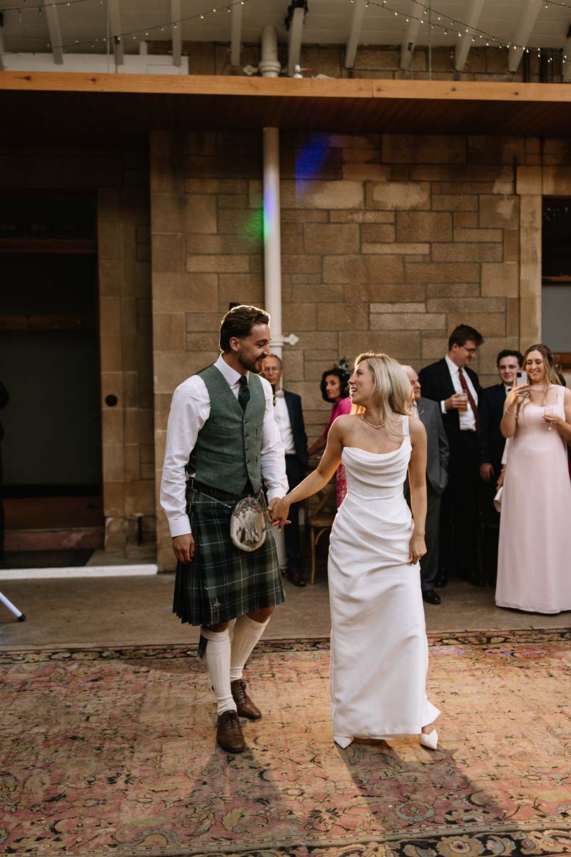 Lia and Louis take to the dancefloor together during their Cambo House wedding reception.