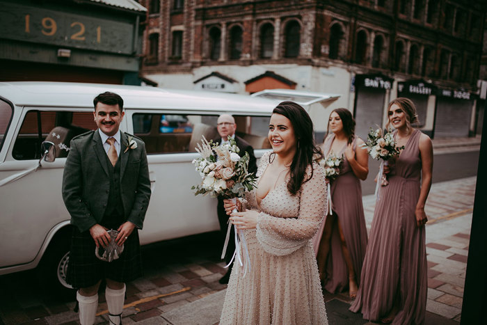 A Bride And Bridal Party At Glasgow Barras Outside Barras Art And Design For A Wedding