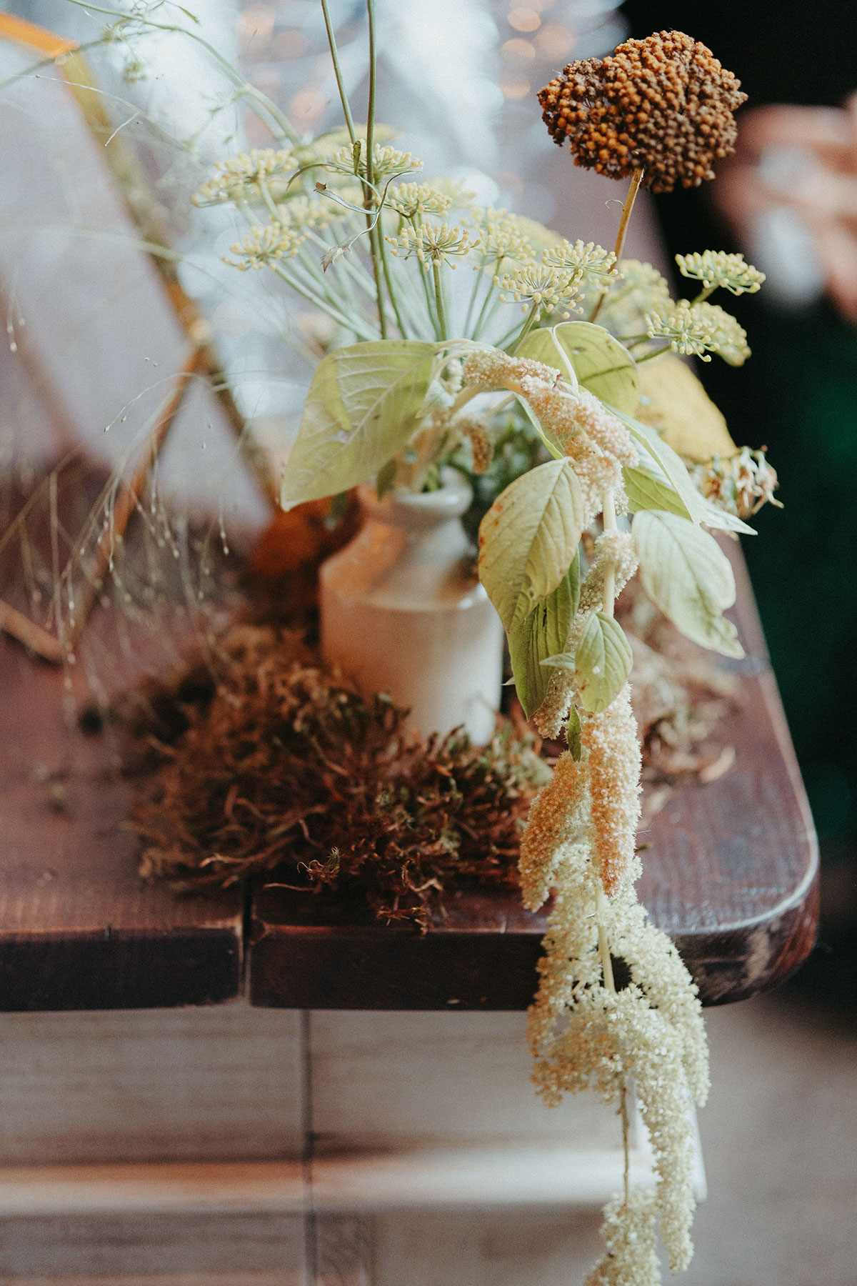 Autumn wedding floral arrangement featuring trailing amaranthus, delicate blooms and seasonal foliage styled for a Cambo Country House celebration.
