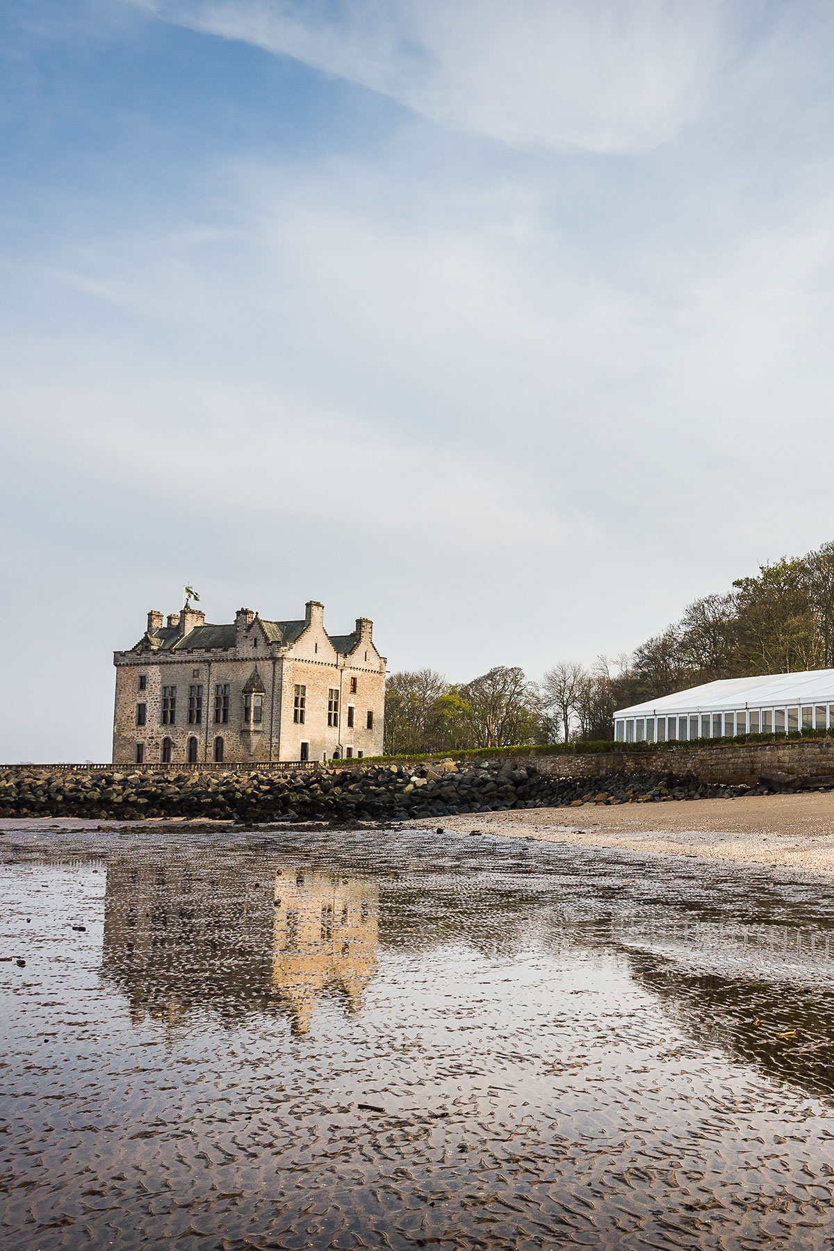 Barnbougle Castle seaside coastal wedding venue exterior with beach and marquee