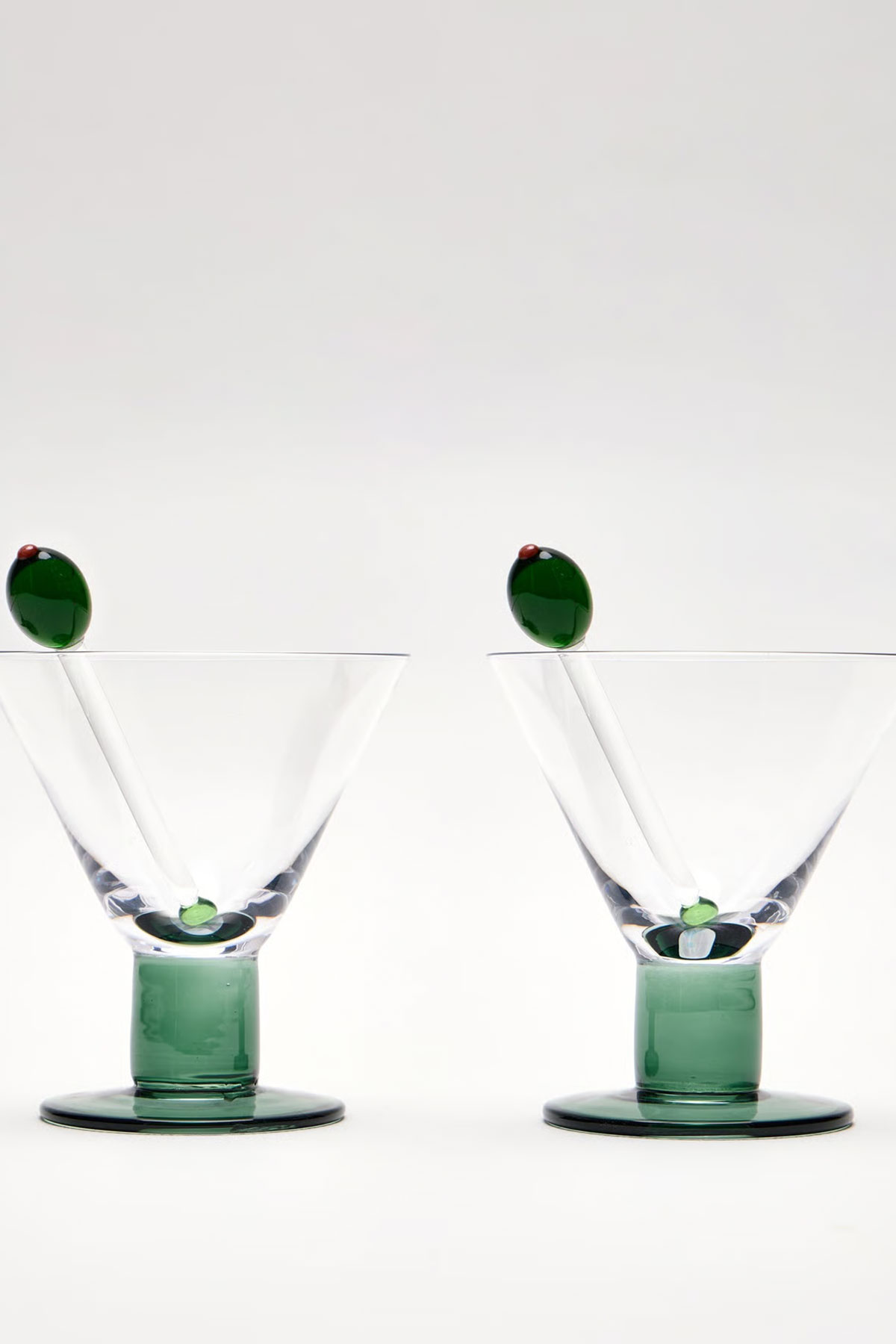 Set of two Oliver Bonas martini glasses with green glass olive details, ideal as a wedding gift for couples who love hosting