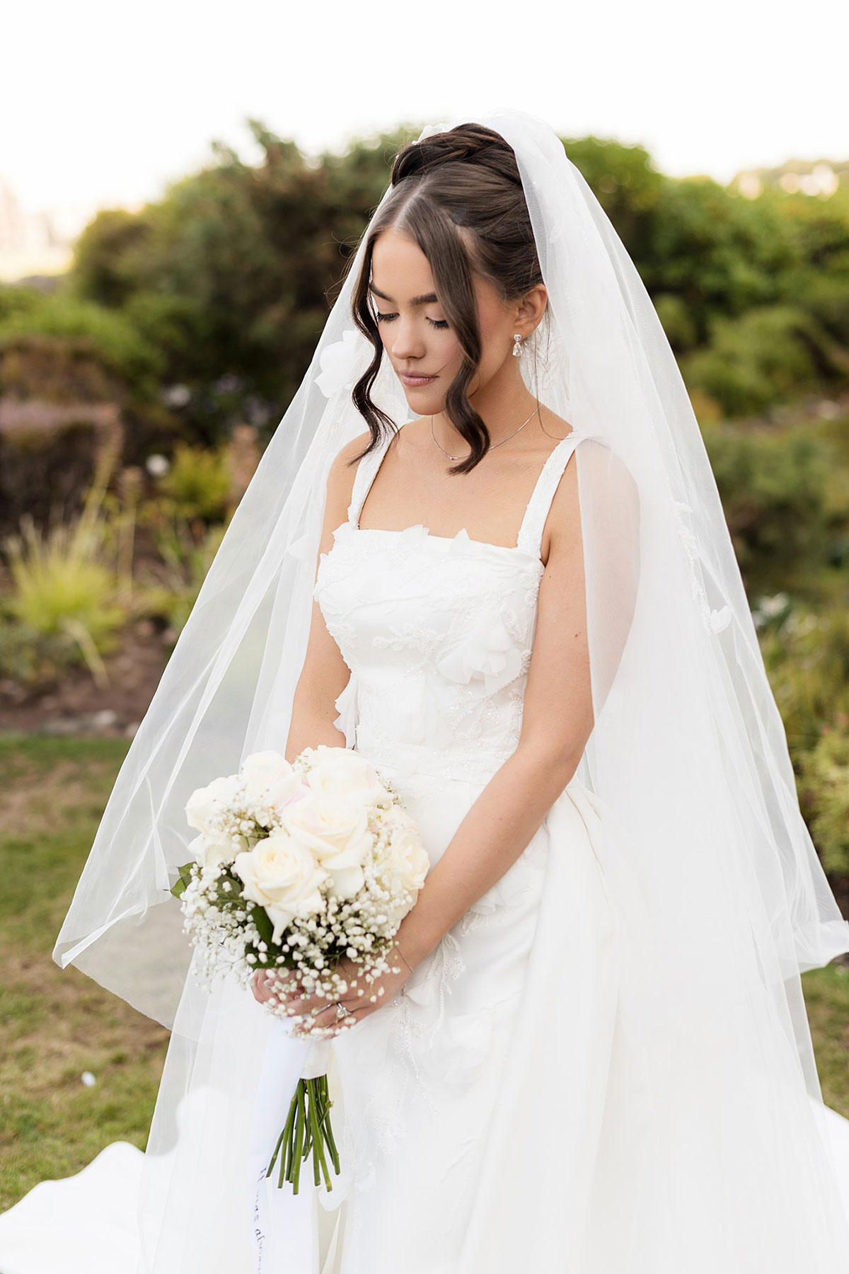 Elegant bridal portrait with veil and white rose bouquet during Old Course Hotel St Andrews wedding.