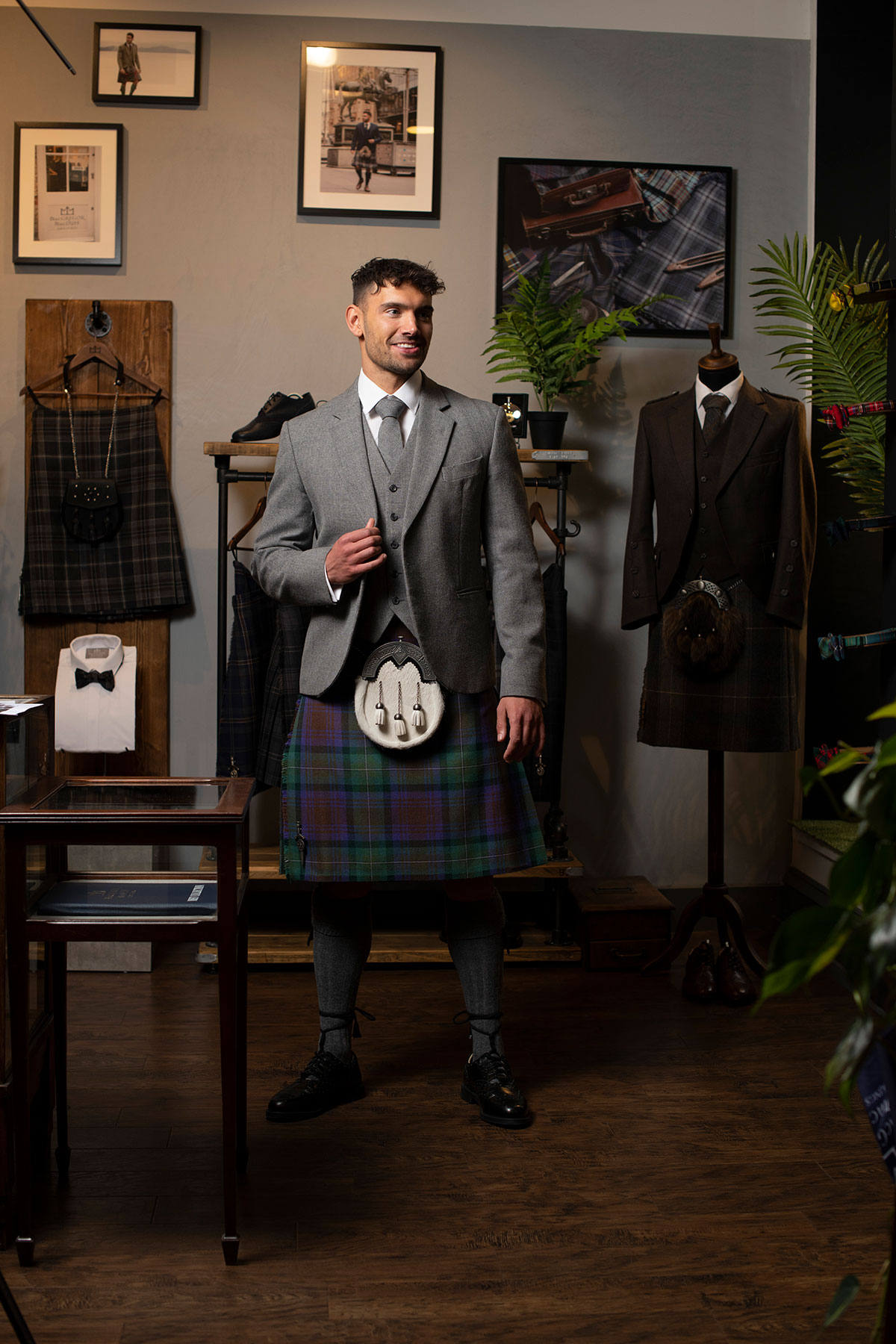Man standing in tartan kilt