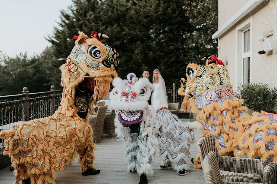 Chinese lion dancers outside Busby Hotel
