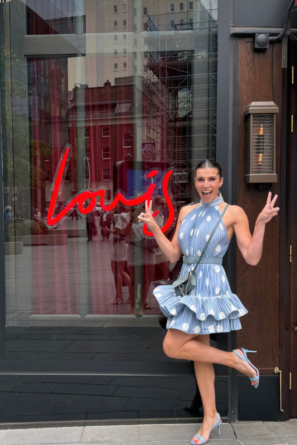 Bride-to-be posing outside Louis in Manchester during her hen do weekend.