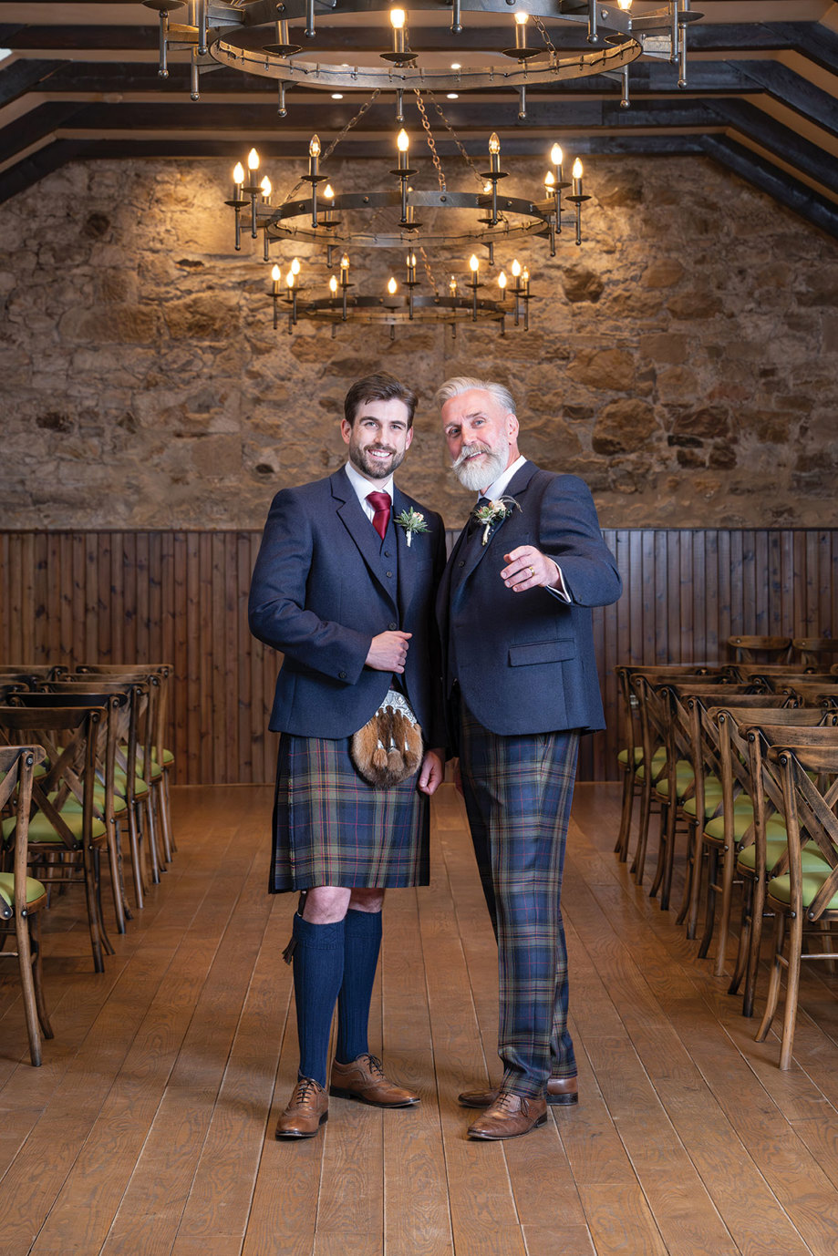 two men wearing Highlandwear outfits from McCalls standing in the Hay Loft at Rosebery Steading