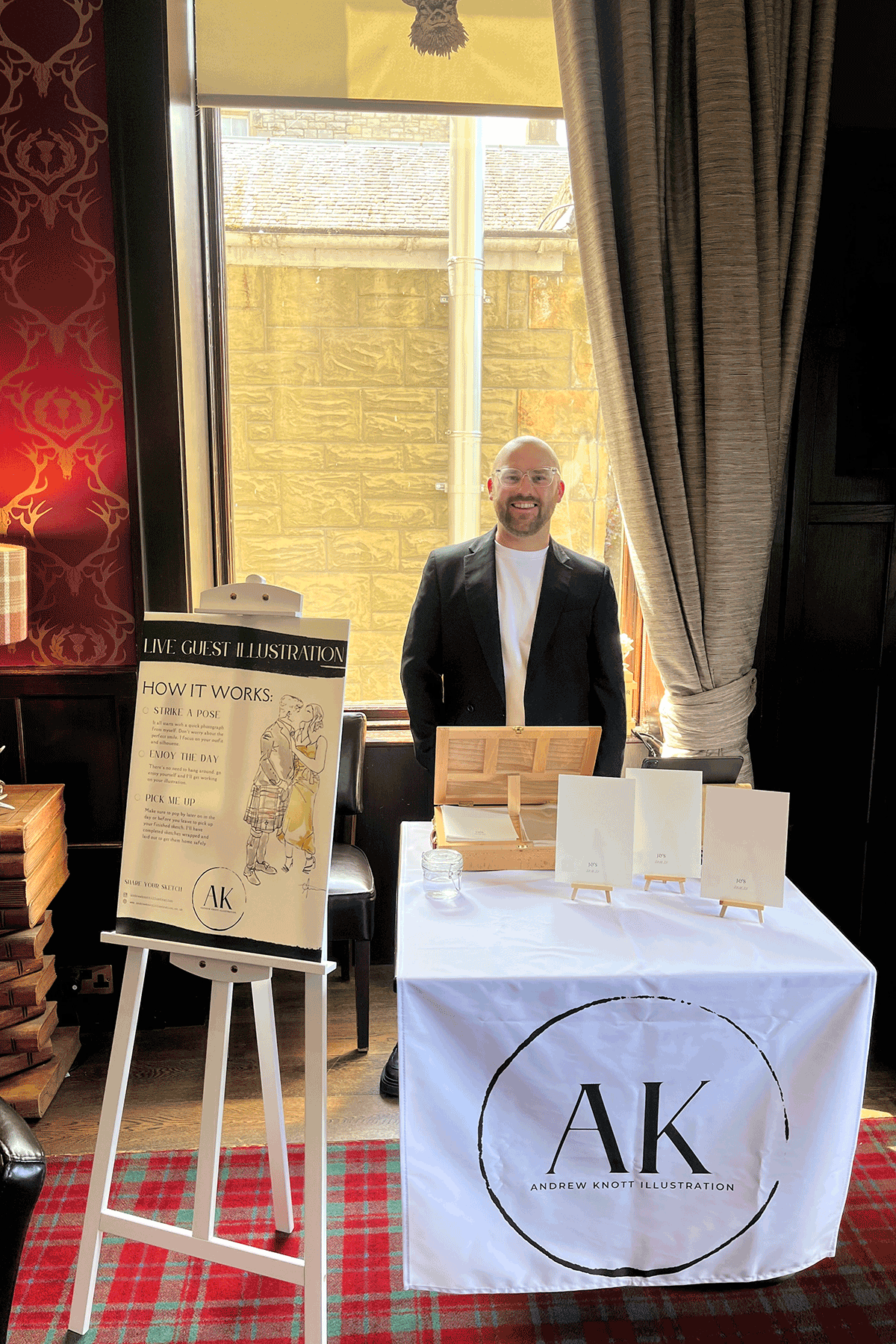 Andrew with his live wedding illustration stall