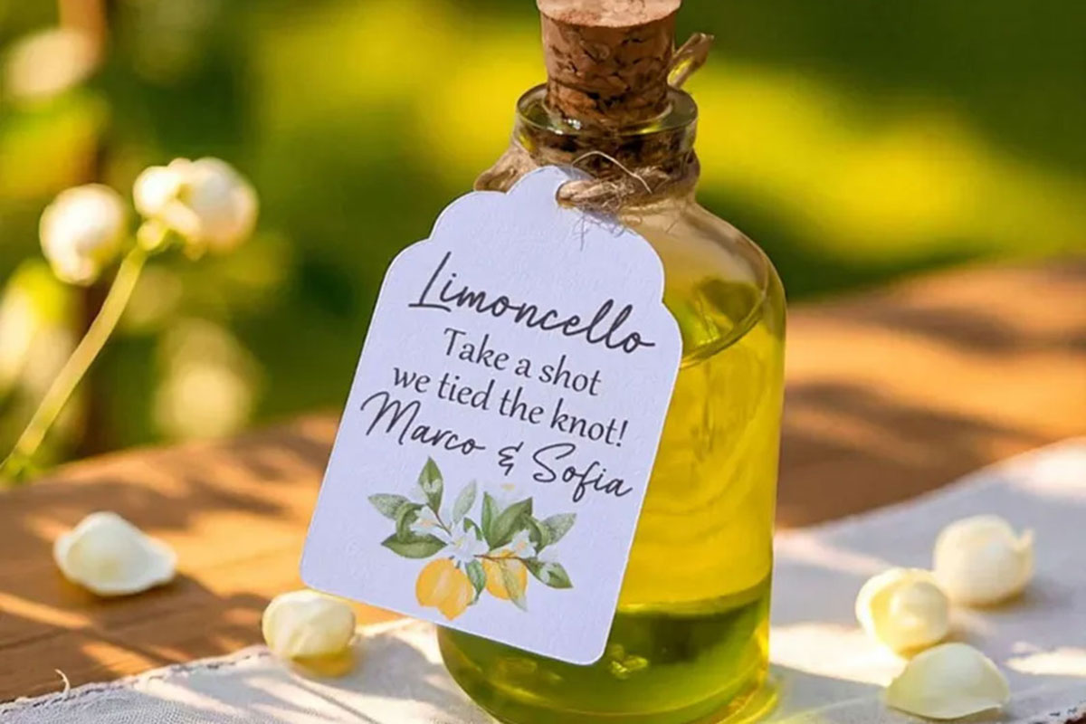 Mini limoncello bottle wedding favour with personalised tag and lemon illustration