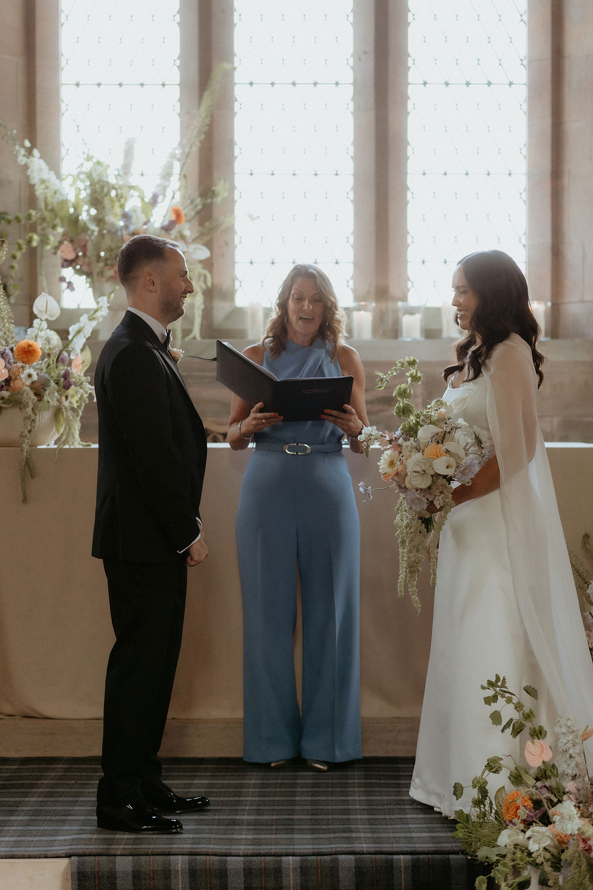 Bride and groom during humanist wedding ceremony inside Rosebery House chapel, Midlothian.