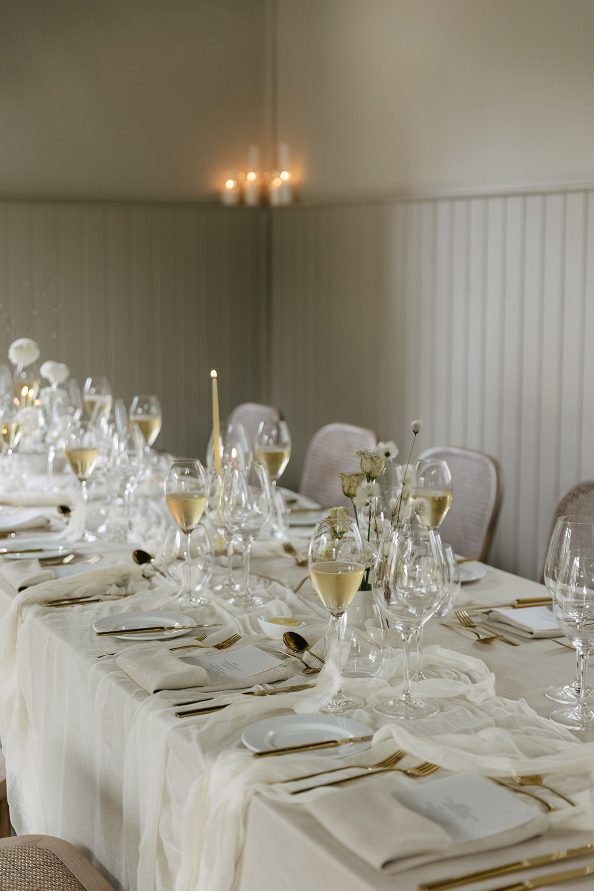 Elegant wedding reception table styling with candles and glassware at Gilmerton House East Lothian