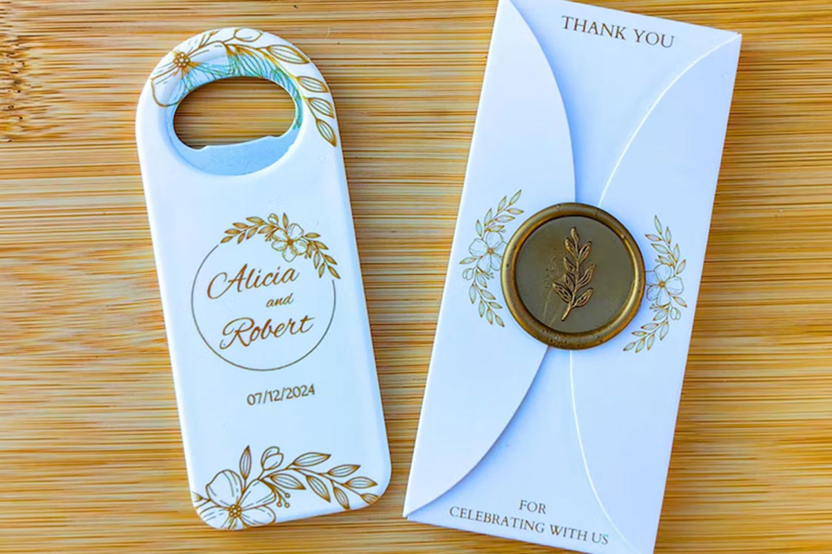 Personalised floral bottle opener wedding favour with thank-you packaging