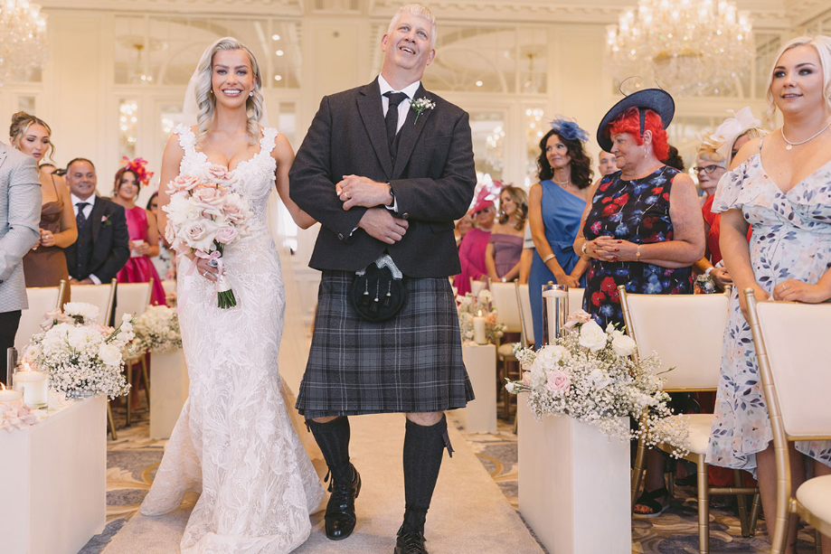 Bride's dad walks her down the aisle