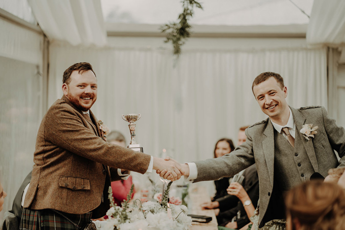 Handshake between groom and guest