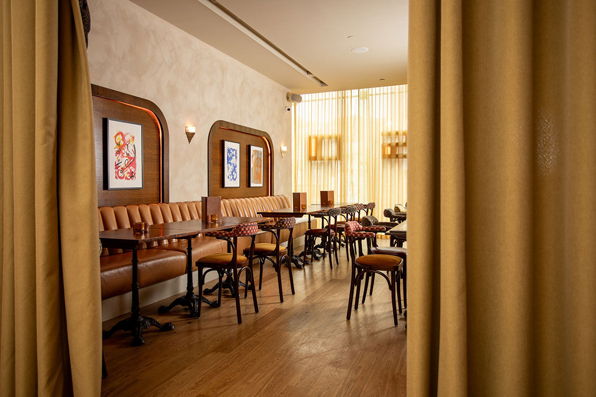Maison by Glaschu in Princes Square, Glasgow, showing its restaurant interior with curtained private dining area, leather seating and warm lighting.