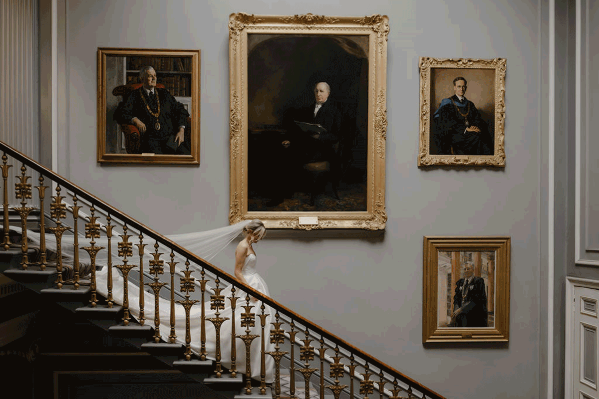 Bride walking down stairs 