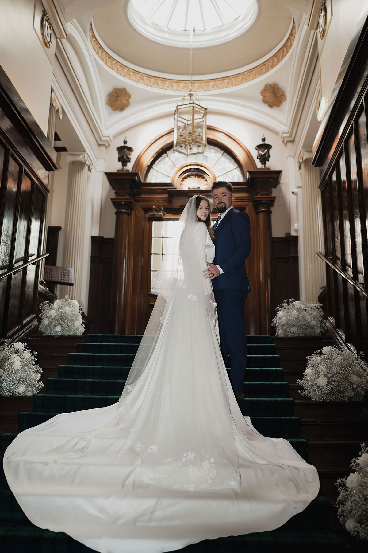 bride and groom stand inside 1599 at the royal college in glasgow