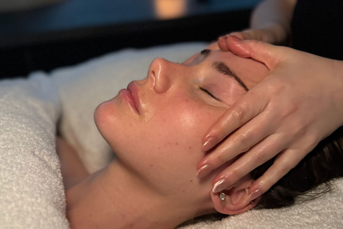 Calming facial massage at FAB Salons, ideal for pre-wedding skincare preparation.