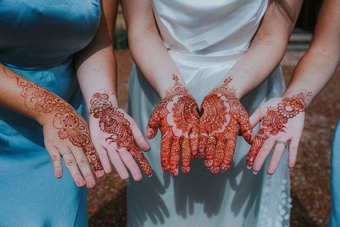 close up of mehndi body art on bride and bridesmaids at cambo house