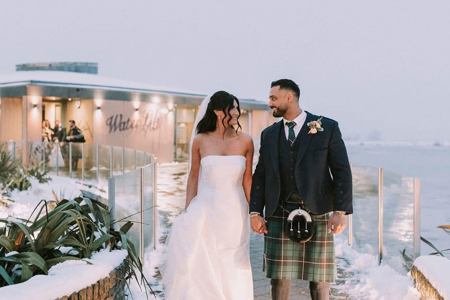 Exterior of the Waterlily Suite at the Vu, a sustainable waterside wedding venue in Scotland. Winter wedding with snow on the ground.