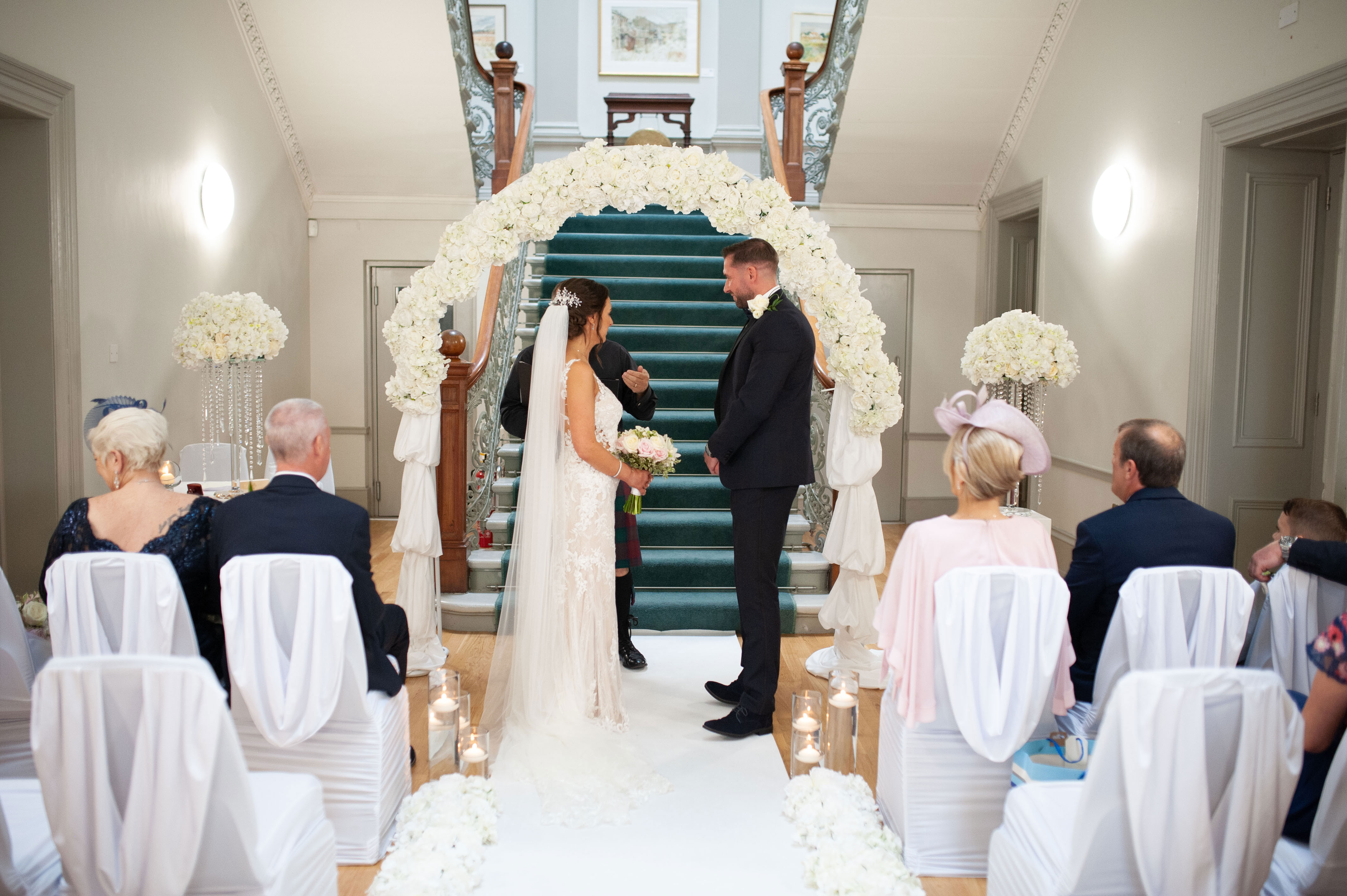 bride and groom get married at indoor ceremony at kilmardinny house