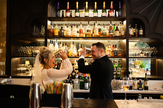 Bride And Groom Shaking Cocktails