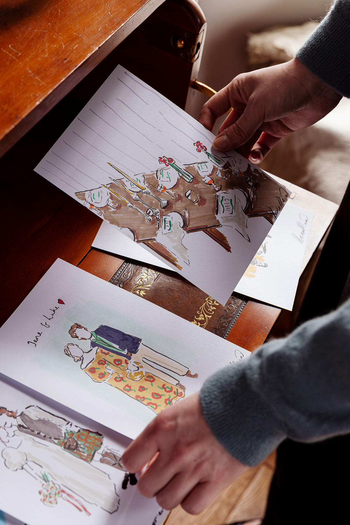 Hand-drawn wedding stationery illustrations laid out on table at The Tower Portobello