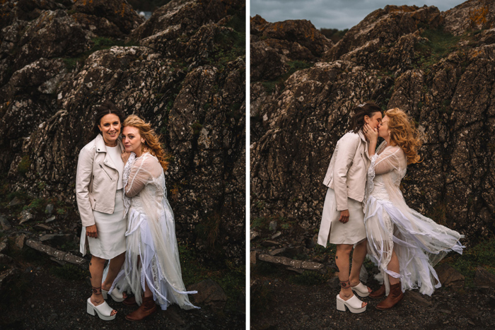 Two Brides Posing And Kissing On Rocks By The Sea