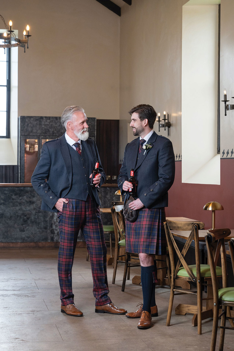 two men in the Pump House bar, one wearing tartan trews from Slanj Kilts and another wearing a kilt in the same Spirit of the Clyde tartan