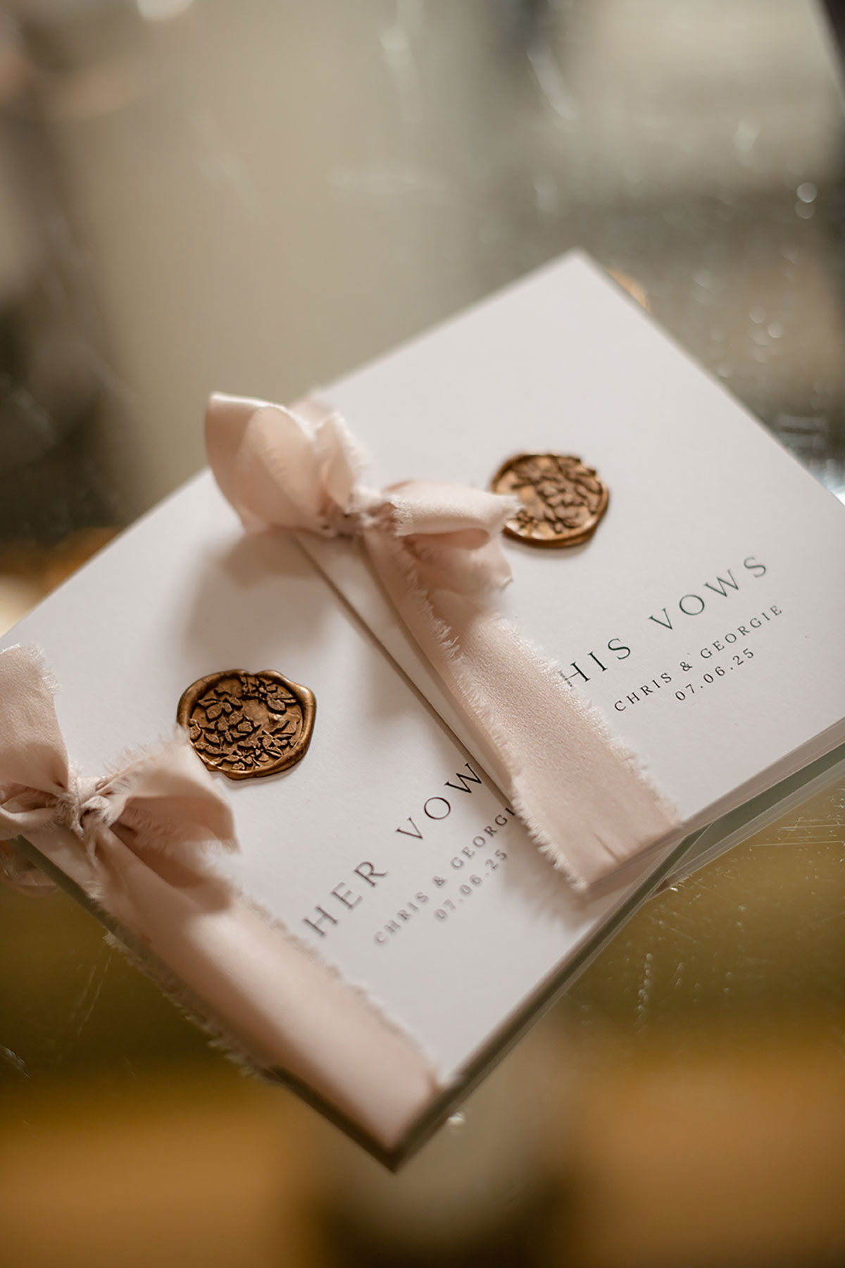 Wedding vow booklets with wax seal and ribbon detail
