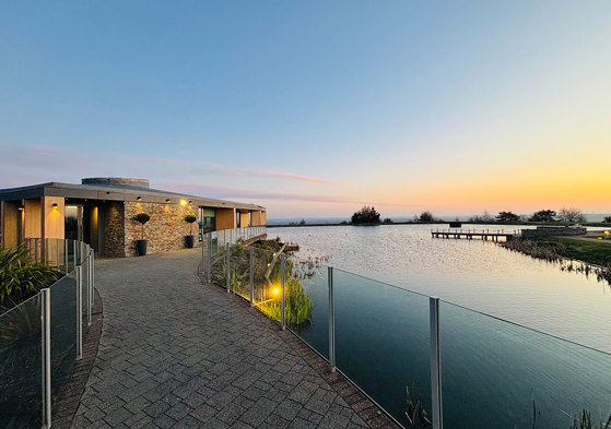 exterior of the Vu Waterlily suite sustainable central Scotland wedding venue at sunset