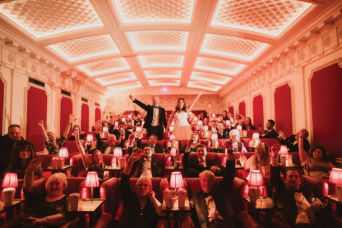 a group of people in a red cinema room at the Scotsman Picturehouse