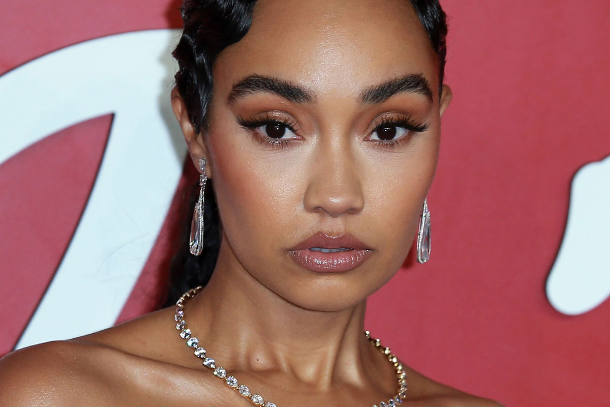 Leigh anne pinnock in a white dress on the red carpet