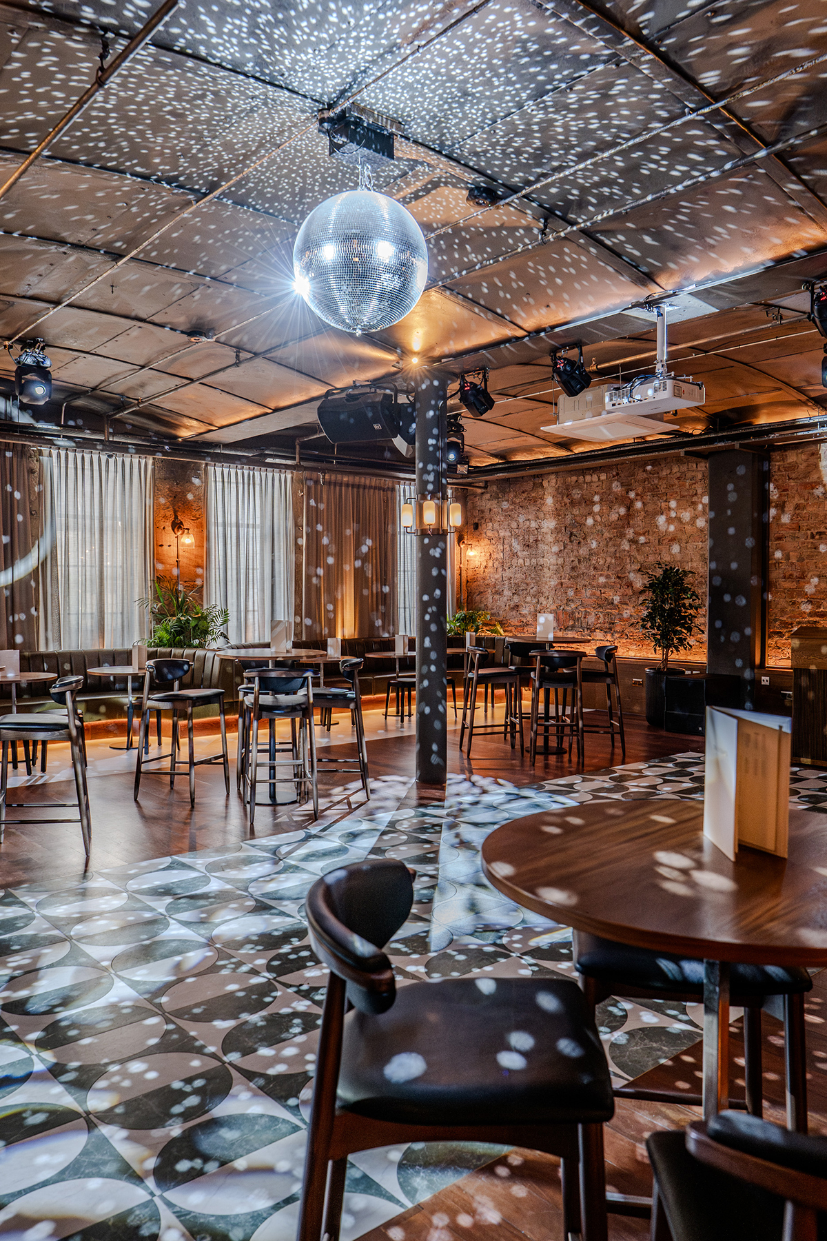 Disco ball lighting inside The Exchange wedding reception space in Glasgow