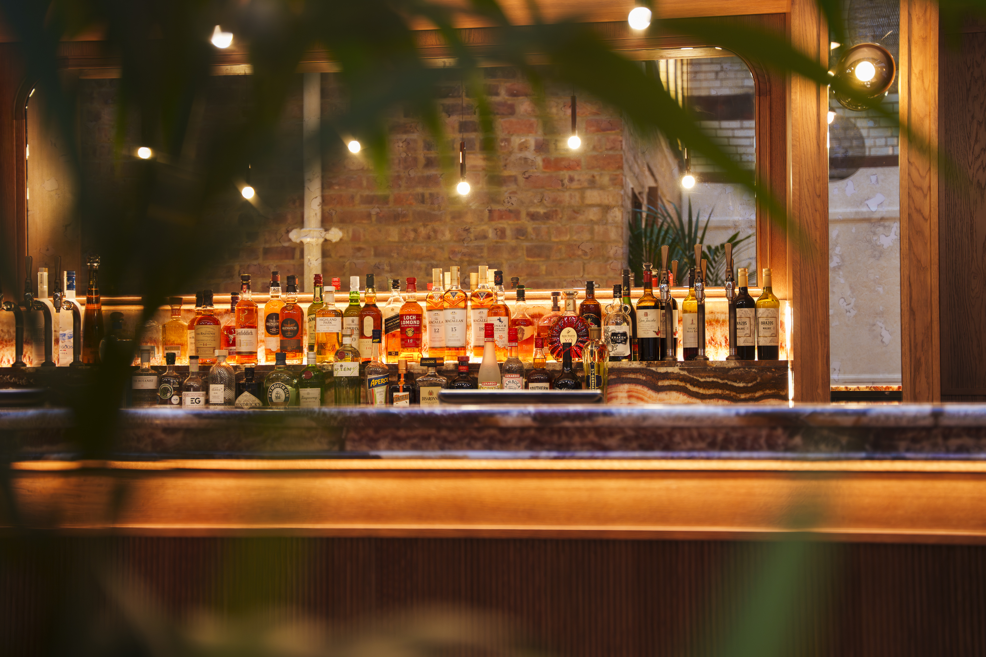 the bar at the collector's hall with marble worktop and mood lighting