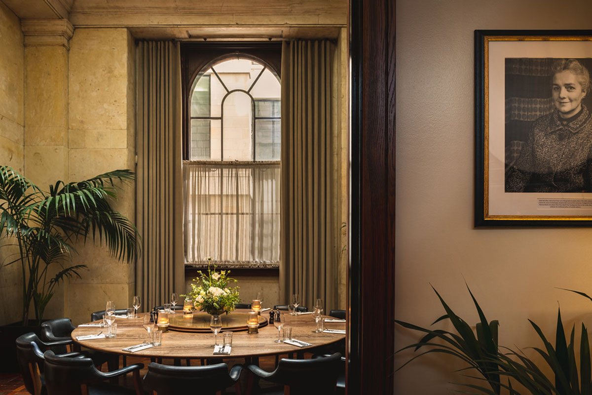 Intimate private dining room set for a wedding with round table, candles