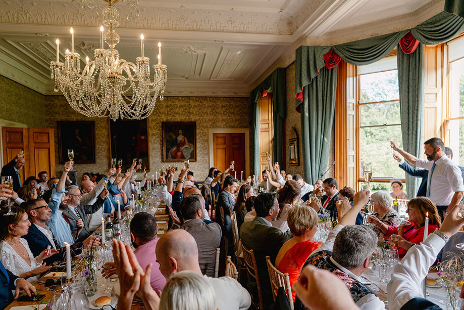 Grooms toast their guests in Cambo House