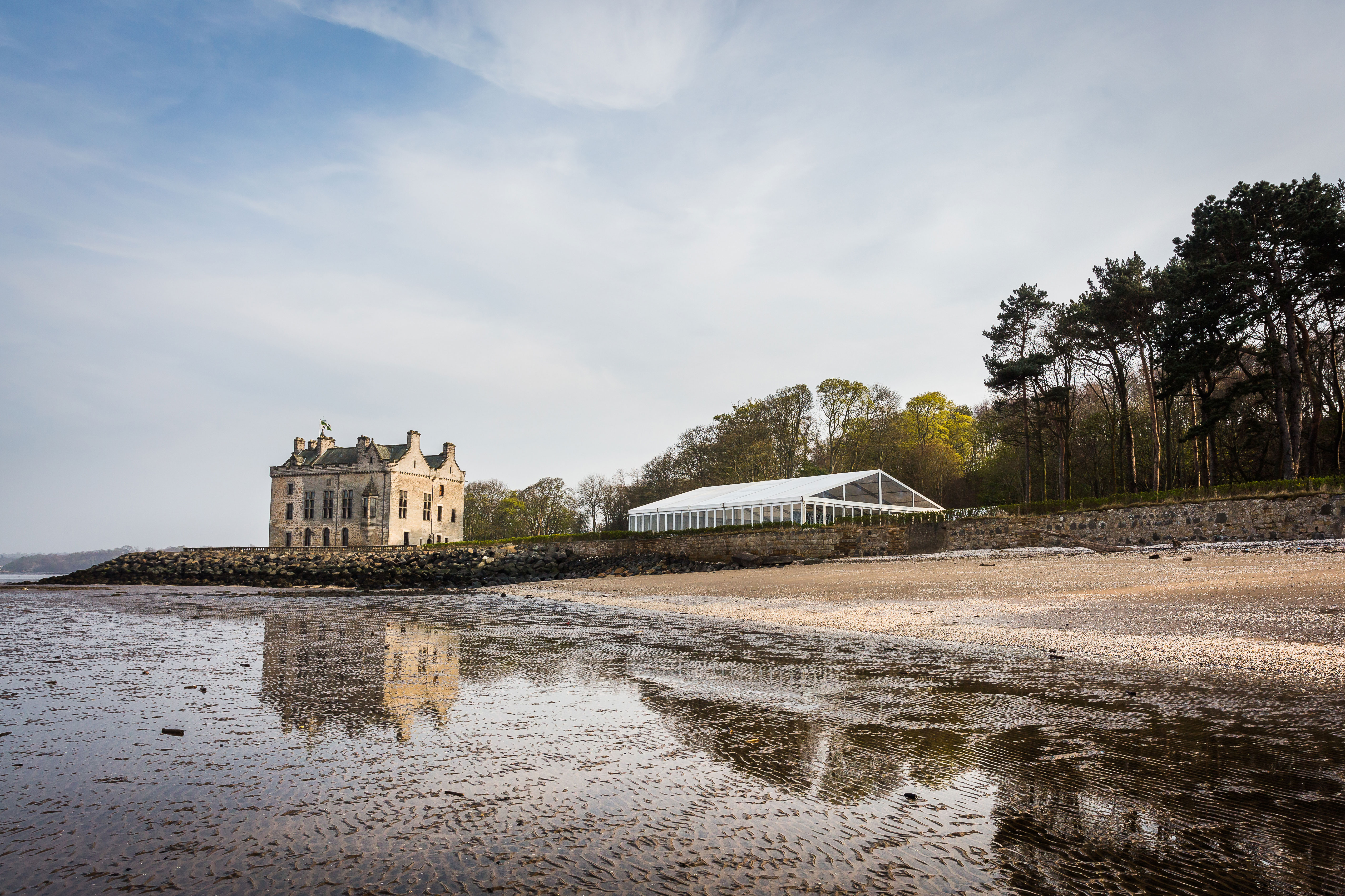 exterior of barnbougle castle with sand in focus