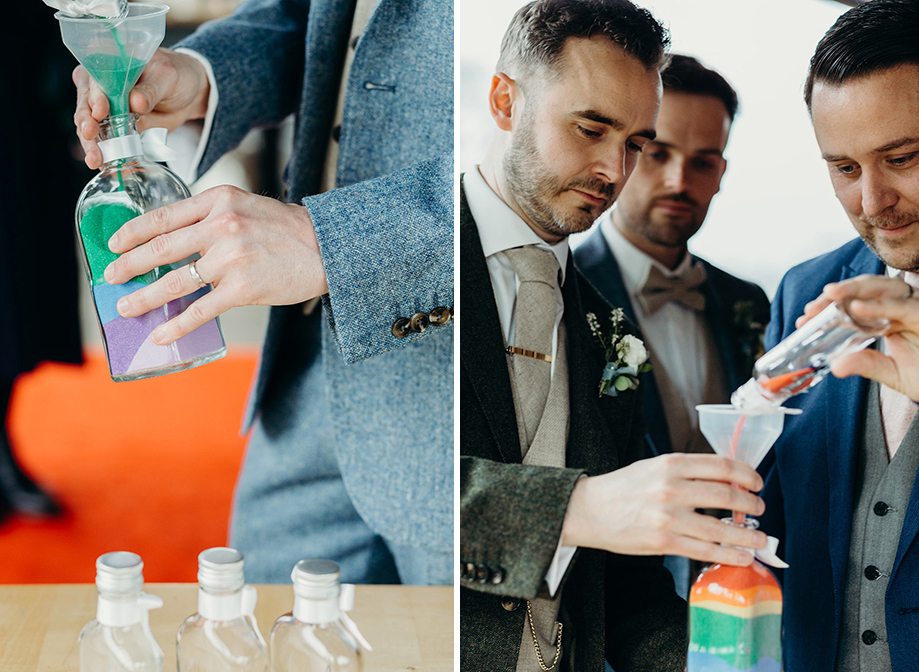 grooms performing a sand ceremony with rainbow-coloured sand