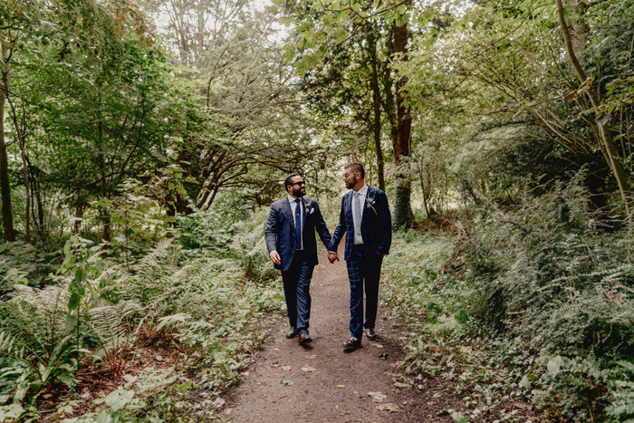 Outdoor couple portraits of two grooms