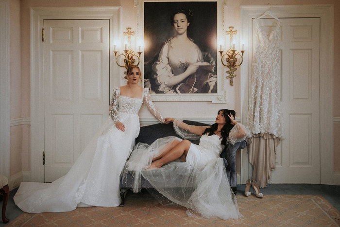 brides sitting on chaise longue Chatelherault styled shoot