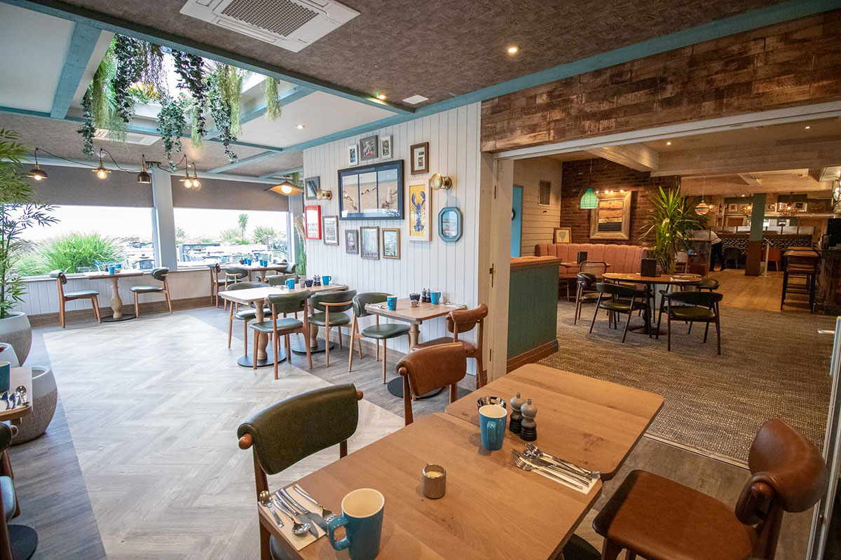 Dunes restaurant interior at The Waterside Hotel in Ayrshire with coastal-inspired décor and sea views