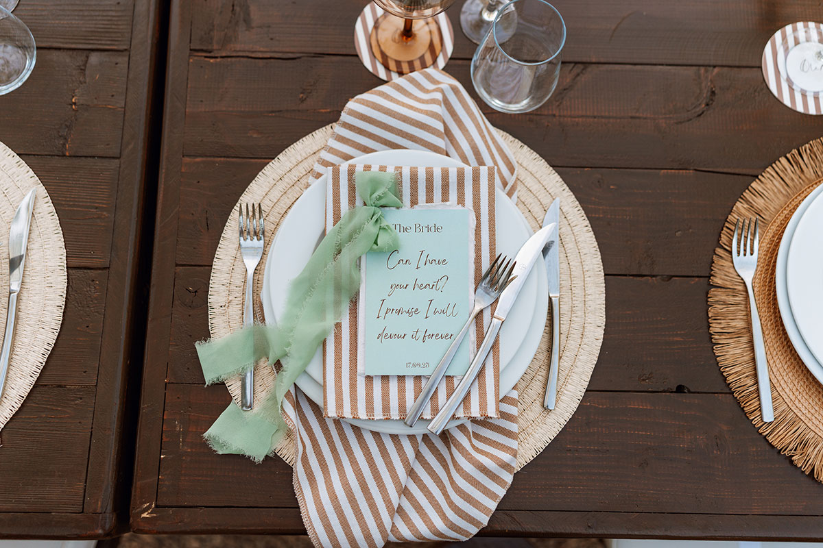 Brown and cream striped wedding place setting with personalised menu at Can Rafal Ibiza reception dinner