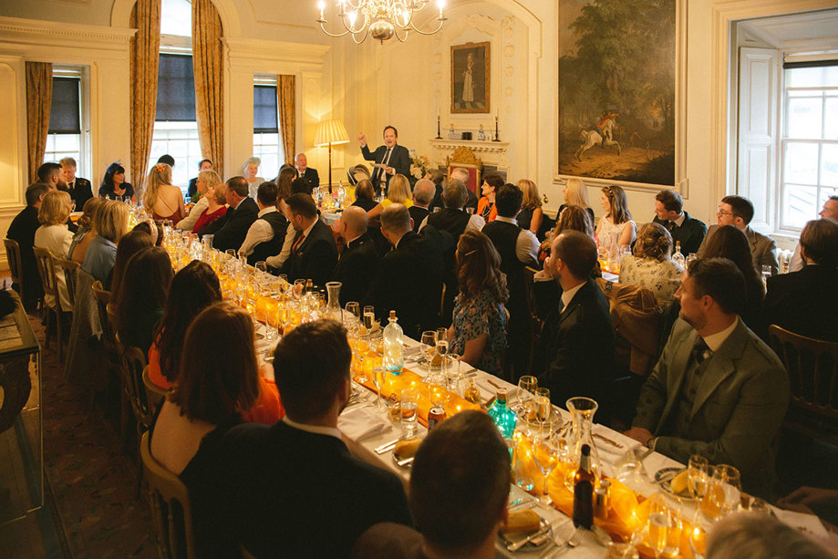 People Seated At Long Tables For A Wedding Dinner At Pollok House