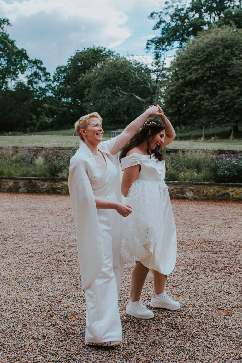 brides twirl in cambo estate's walled garden on wedding day